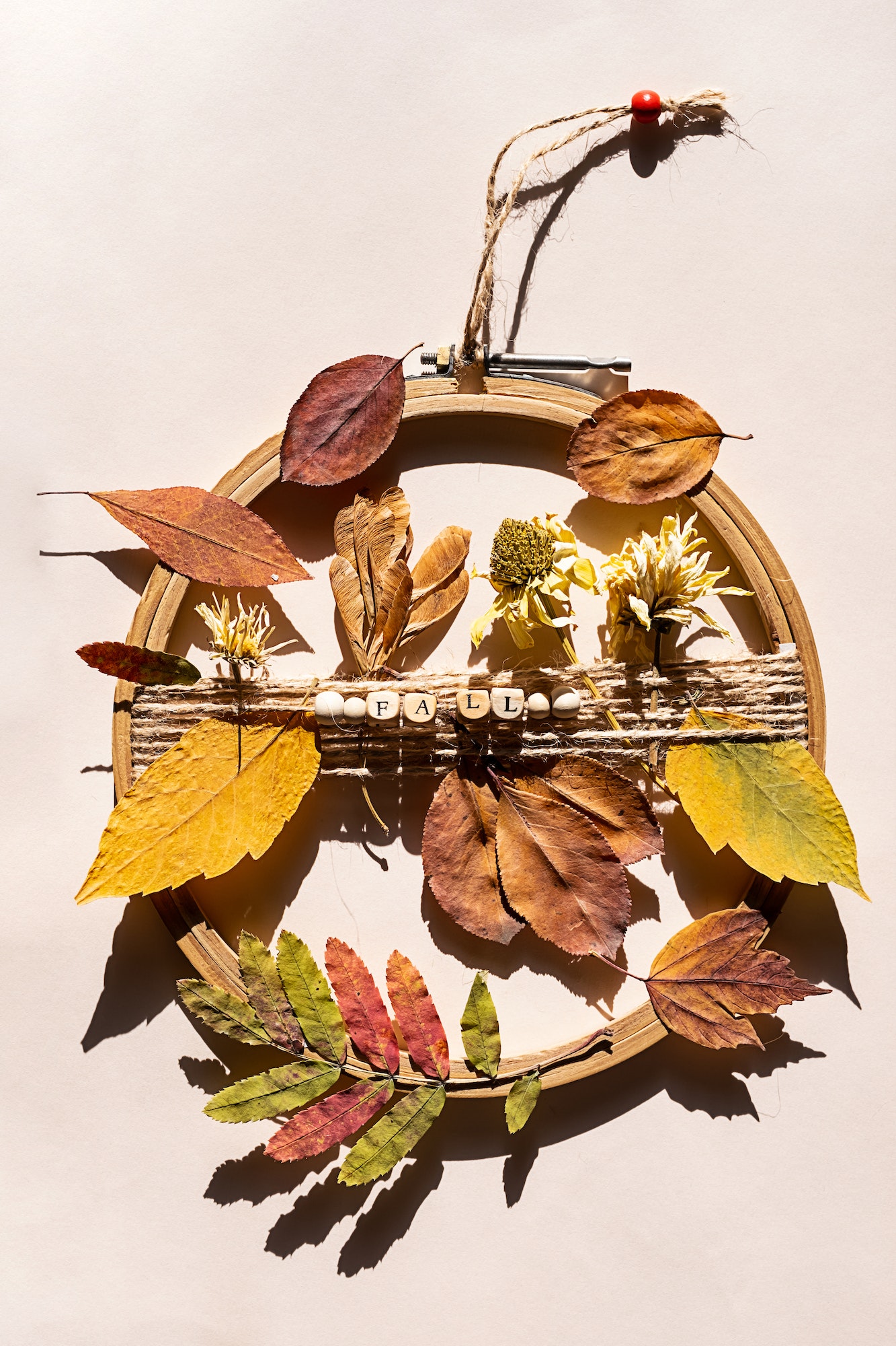 DIY Door Wreath from Autumn Colourful Leaves and Flowers. Fall Home Decor.